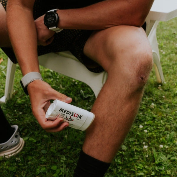A man applying the Power Stick to his knee